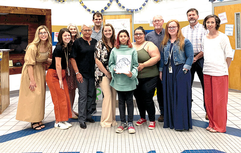 Carey Counseling Center's development team met with Huntingdon Special School District leadership, Lilith Cumba and her mother, Selina, to present Lilith with copies of the book her illustrations inspired.