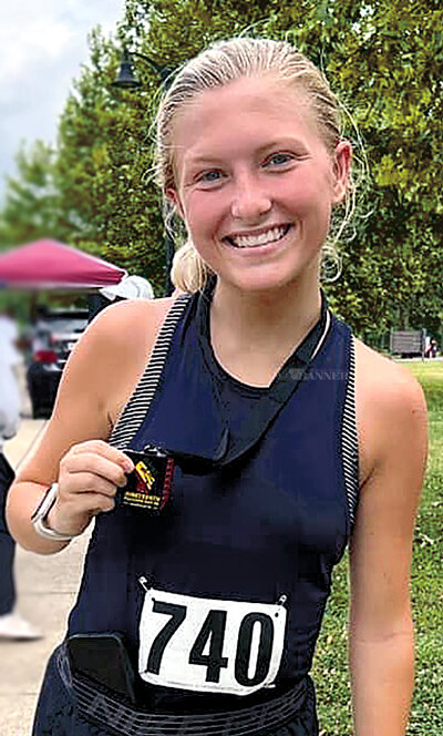 Allie Chappell received a Juneteenth Freedom Day 5K medal after her run.
