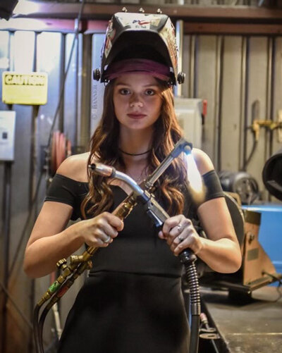 Ninness wore her prom dress and held welding tools during her senior photoshoot.