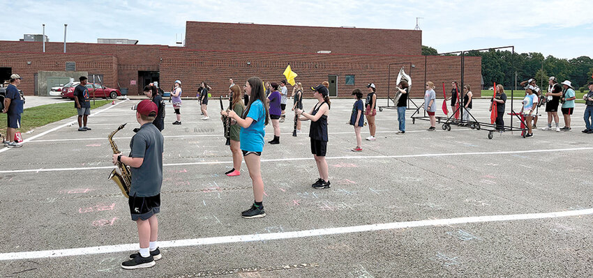 The Marching Rebels practice outside for this year&rsquo;s field show, a salute to &ldquo;The Phantom of the Opera.&rdquo;