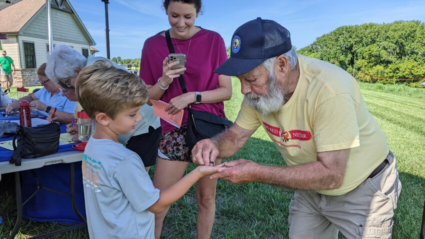 Luke Seratt gets to release a ruby-throated hummingbird with banding volunteer Mitz Bailey as his mother, Meagan Seratt takes photos.&nbsp; The refuge will once again hold their family-friendly hummingbird banding event Saturday, August 12th from 8 a.m. - 3 p.m. with a pause for a program at 11 a.m.&nbsp; The Friends of Tennessee NWR will host the event and offer lunch for sale and a chance to &quot;Adopt a Hummingbird&quot;!