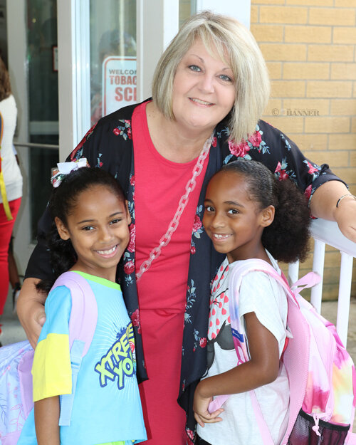 Oshyn Taylor and Jazzlyn Carroll with MES Principal Tonya Brown.
