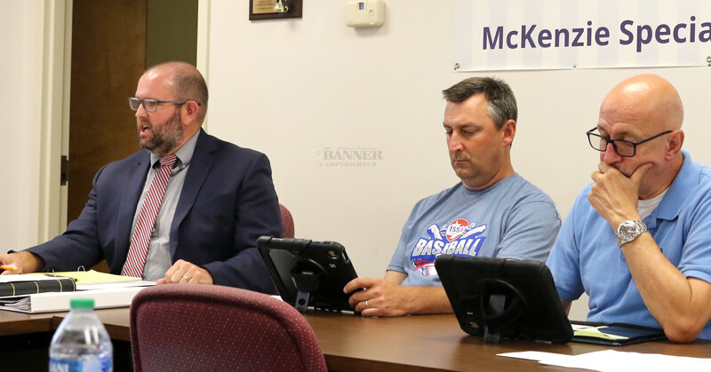 Director of Schools Dr. Justin Barden, and board members George Cassidy and Bobby Young. Board members were issued iPads to receive their board correspondences and agendas.