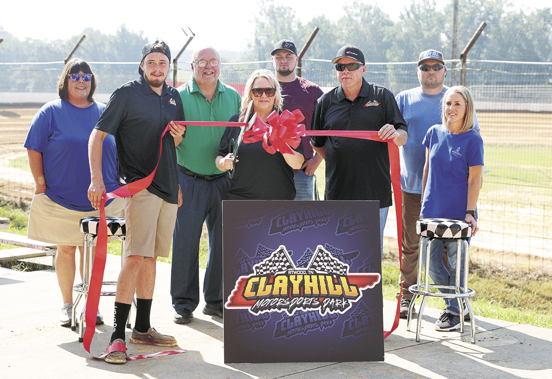 Carroll County Chamber of Commerce hosted a ribbon-cutting ceremony at Clayhill Motorsports Park on Friday, August 25, 2023. Candy Clem and Rodney Clem helped cut the ribbon for the grand reopening of the track. In the photograph are Brad Hurley, President of the Chamber, Riley Clem, Dylan and James Moon of Clayhill, and Sherry Seavers and Ginger Foster of Centennial Bank.
