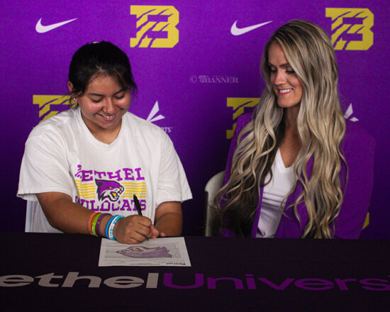 Gleason softball player Claudia Pineda (left) signs her athletic contract in front of Bethel University&rsquo;s Softball Coach Katherine Hannagan.