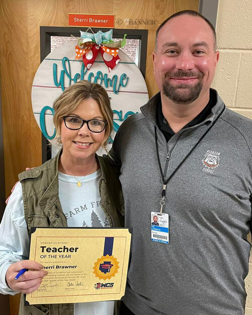 Sherri Brawner, a third grade teacher at Gleason School, was honored as the Teacher of the Year. She is pictured with her principal, Lee Lawrence.