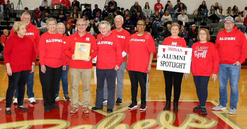 Nancy Holland, MHS Class of 1949, honored as a member of the undefeated 1949 Rebelettes. Pictured are members of the McKenzie High School Alumni Association: LaRenda Scarbrough, Byron Rich, Karen Campbell, Gale Edwards, Kelly Spivey, Nancy Holland, Terry Howell, Tracy Brown, Kay Brown, Diane Stafford, and Brian Stafford.