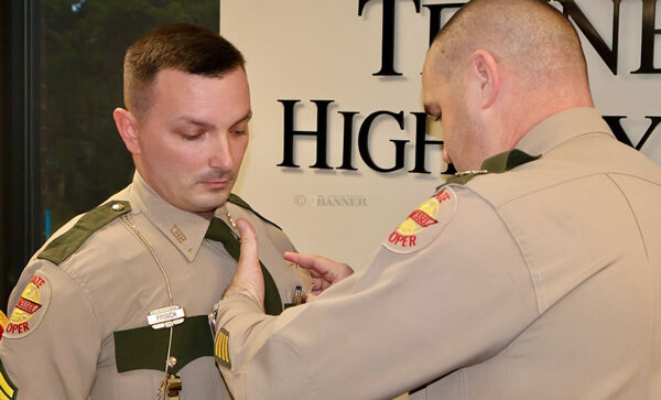 Colonel Matt Perry pinned the insignia on French&rsquo;s uniform to signify the promotion to sergeant.