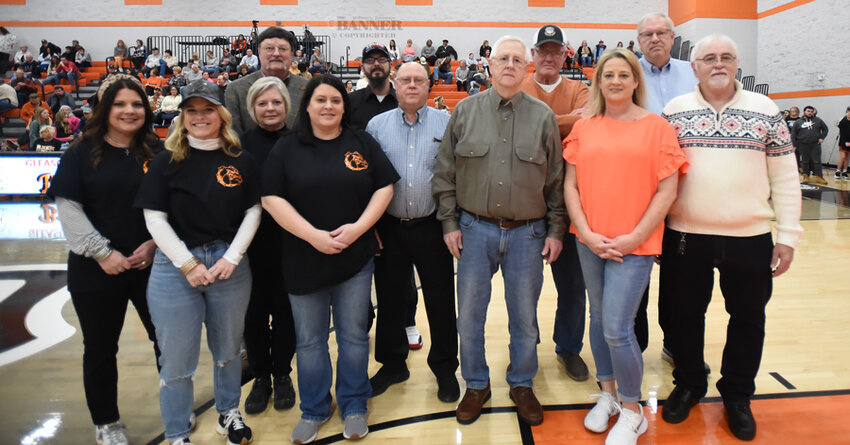 The 1969 Gleason Bulldogs and family representatives of deceased members of the team.