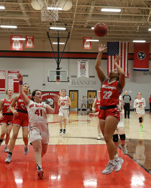Mikaela Reynolds shooting a floater against the Lady Devils defense.