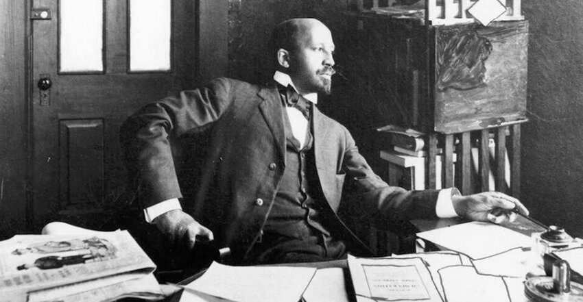 W. E. B. Du Bois, seated at his desk, Atlanta, Georgia, 1909.