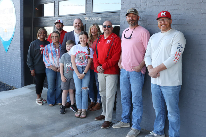 New MHS Football Coach Keith Hodge, his wife, Ashley, and children, Elle and Maddox were welcomed to McKenzie during a reception on Saturday, April 6 at Hometown Hangout. Pictured are members of the McKenzie School Board, Director Justin Barden, and the Hodge family. (L to R) LaShonda Williams, Misty Aird, Justin Barden, Maddox Hodge, Keith Hodge, Ashley Hodge, Elle Hodge, Bobby Young, George Cassidy and Chad Brown.