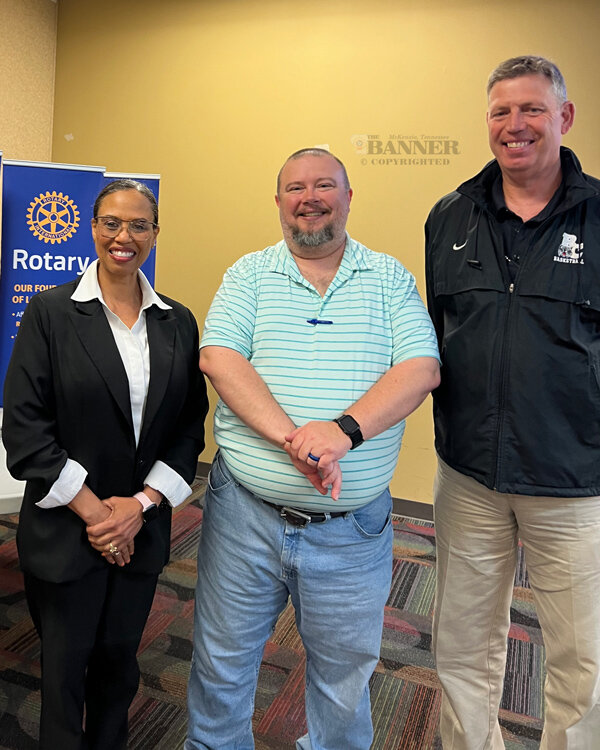 Phoebe Presson (left) and Jeff Britt (right) are welcomed by Rotary President Jason R. Martin.