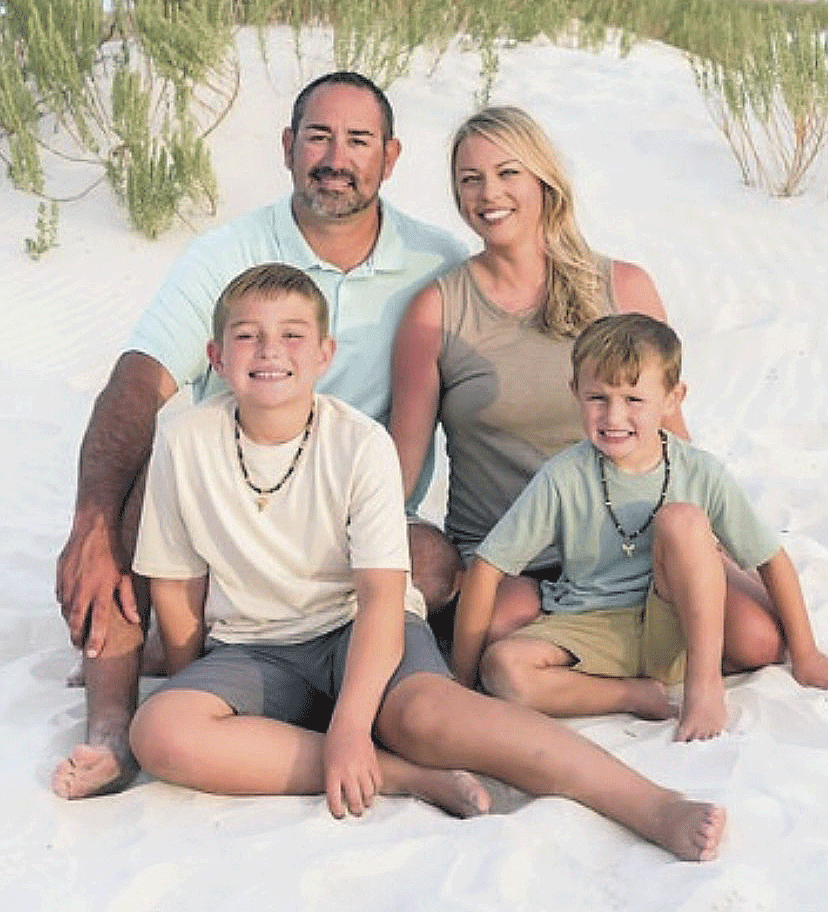 Coach Justin Lowery, wife, Suzy, and two sons, Knox and Mac is the new boys' basketball coach at McKenzie High School for the 2024-25 year..