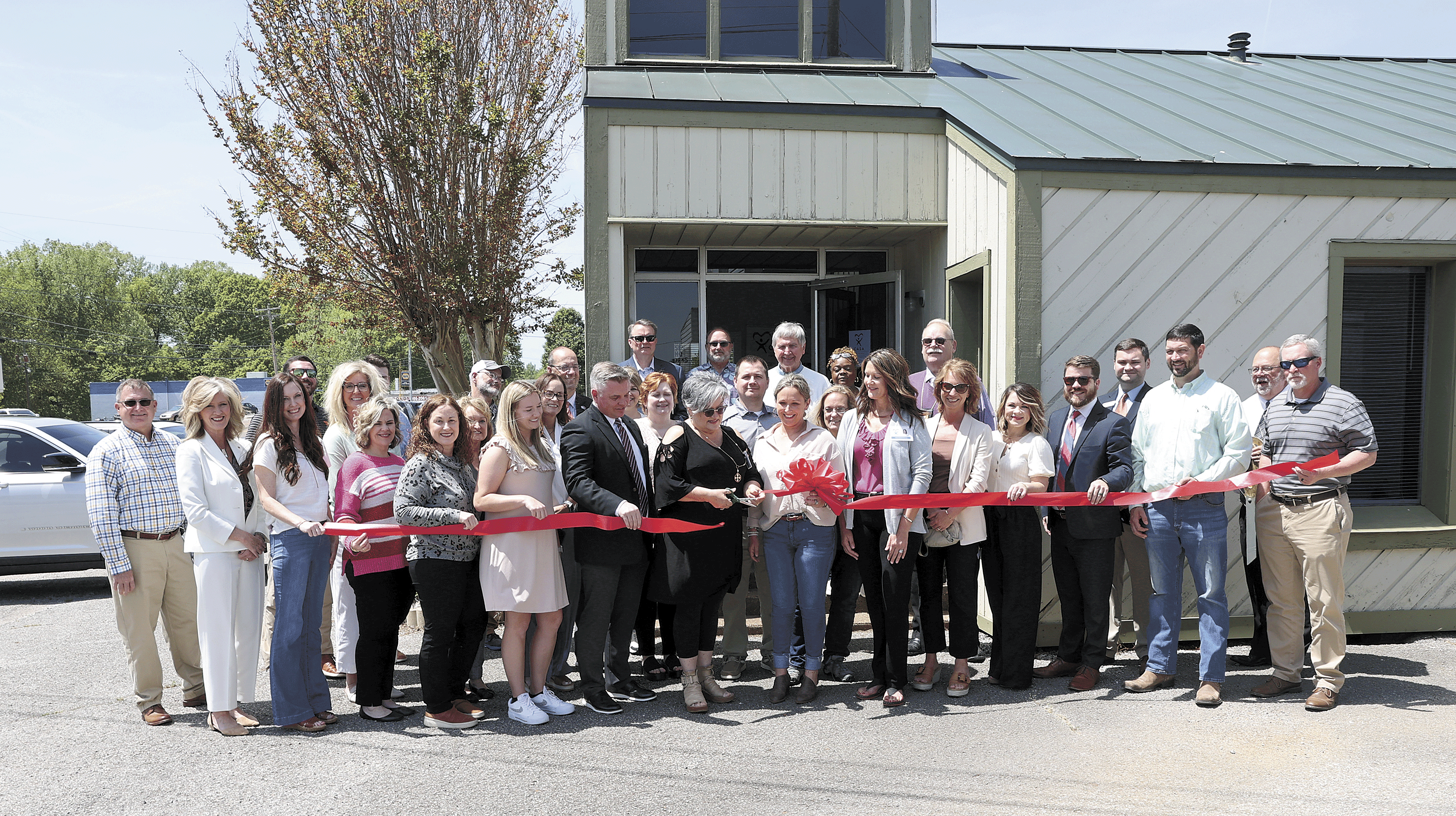 APRIL 23, 2024 - Treva Maitland, executive director of CASA-Midwest, cuts the ribbon for the new offices of CASA-Court Appointed Special Advocates in Carroll County.