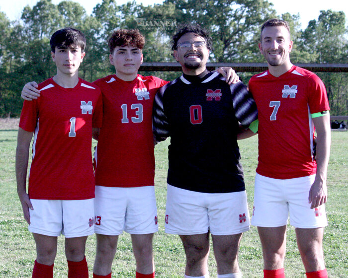 Pictured are the McKenzie High School Soccer Seniors (L to R):  Victor Laguarda, host parents David and Jessica Hochreiter; Mario Flores, son of  Claudia Gonzalez; Luis Tellez, son of Edith Tellez; and Stafford Roditis, son of Spiros and Sandi Roditis.