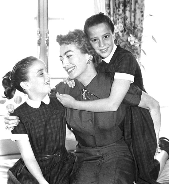 Joan Crawford with her adopted fraternal twins Cathy and Cindy who were provided by Georgia Tann.