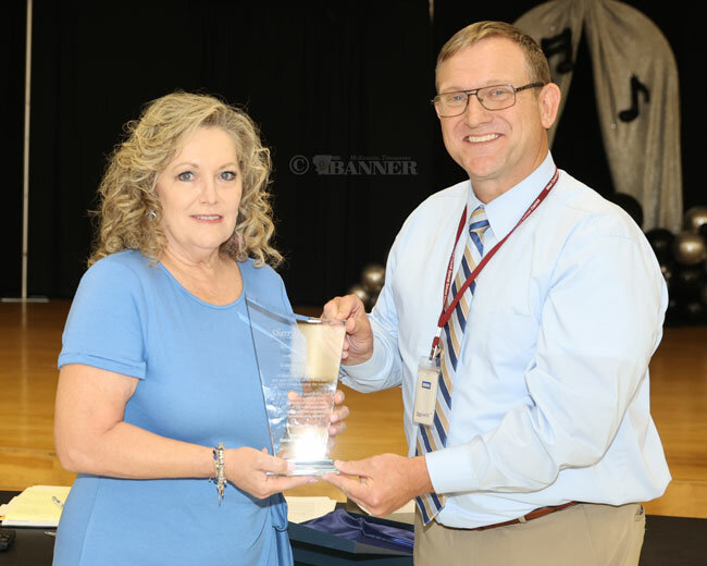 Sherry Cockrill was honored for 39 years of teaching at West Carroll. Preston Caldwell, director of schools, is pictured with her.