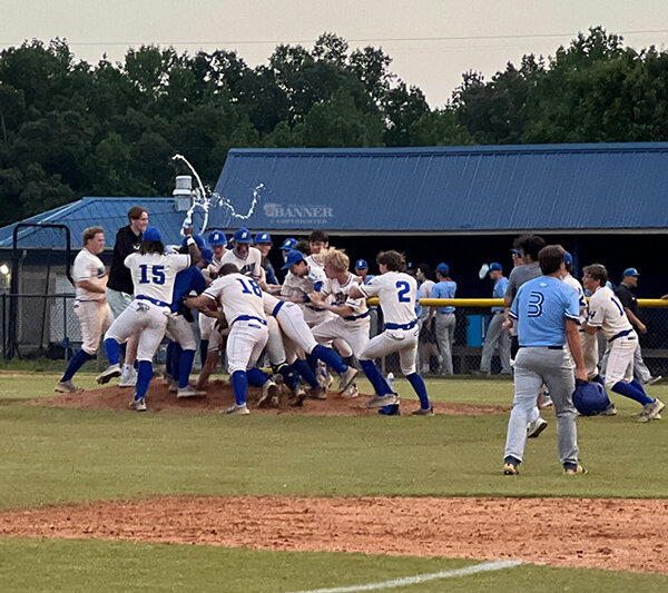 The Mustangs celebrate as a team after advancing to the State Tournament.