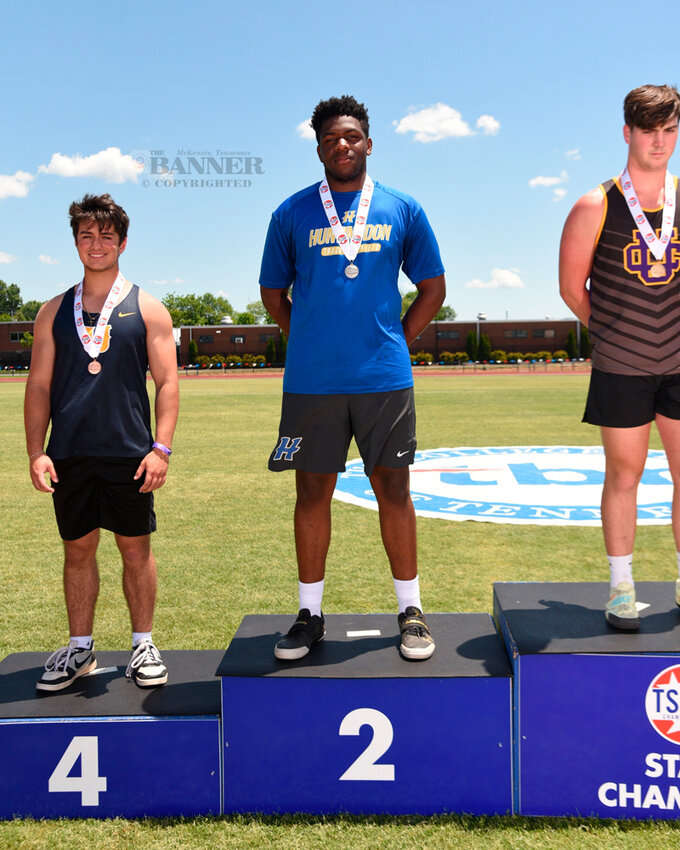 Tycen Willis (center) represented Huntingdon in the discus throw.