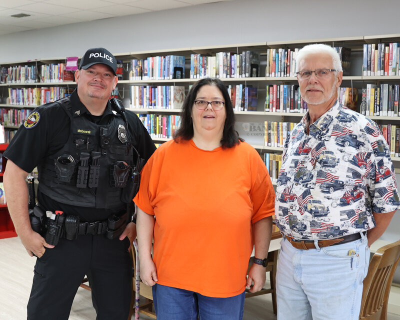 Sergeant Jonathan McDowell with Gleason P.D., Michella Wilson, librarian, and Mayor Charles Anderson at the open house of the newly renovated Gleason Memorial Library.