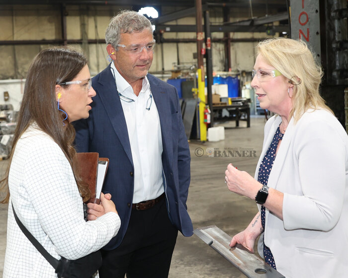 State Representative Tandy Darby and Assistant Commissioner of ECD Jamie Stitt listens as Carol Holt speaks about the manufacturing process at Haven Steel in McKenzie.