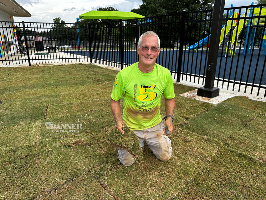 Roughly 8,400 sq.ft. of sod was laid down in 25 minutes by dozens of volunteers.