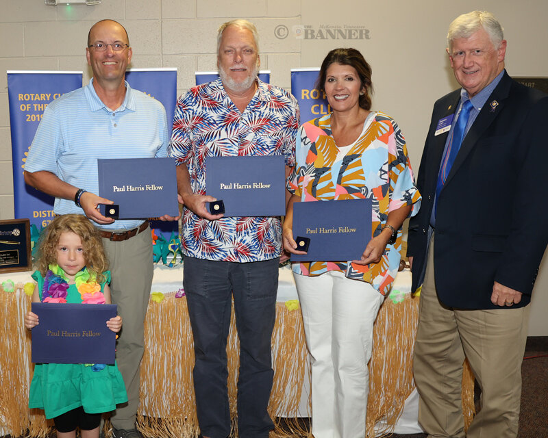 The McKenzie Rotary recognized four new Paul Harris Fellows (L to R) Savannah Martin, Spiros Roditis, James Terrell and Susan Dyer. District Governor Darrell Ailshie (right) presented pins to each new fellow.