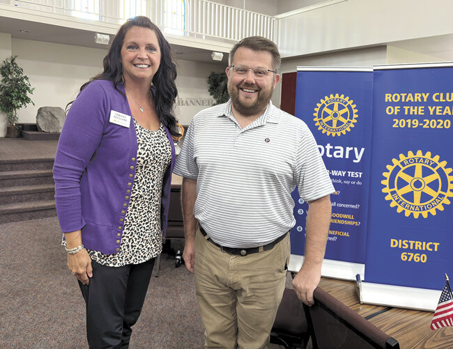 McKenzie Rotary Club President Christy Williams (left) with featured speaker Travis McLeese.