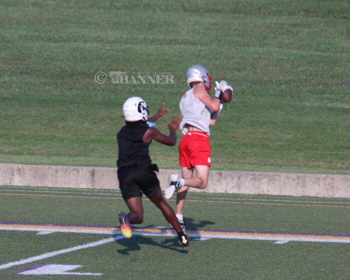 Avery Brown catching a pass from Tate Suber to get a first down.