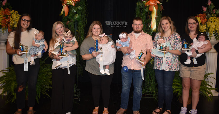 Girls Under Six Months (L to R): Third Maid Oakley Moore, three months, daughter of Rylee Holladay and Johnathan Moore; First Maid Vallie Rose Williams, five months, daughter of Savannah and Josh Williams; Queen Sunny Brooke Thompson, four months, daughter of Clay and Tyler Brook Thompson; Second Maid Layla Collins, three months, daughter of Devan and James Collins; Fourth Maid (tie) Ryleigh Mae Kee, two months, daughter of Ryan and Amber Kee; and Fourth Maid (tie) Grace Ezell, two months, daughter of Emily and Spencer Ezell.