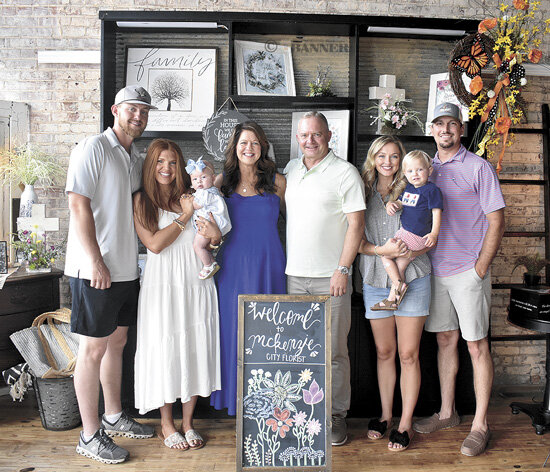 (L to R): Zach Jarrett with wife Carson and daughter Andi, Michele Jarrett and Steve Love, and Morgan (Jarrett) Richards with husband, Drake, and son, Reed. Not pictured is Evan Jarrett.