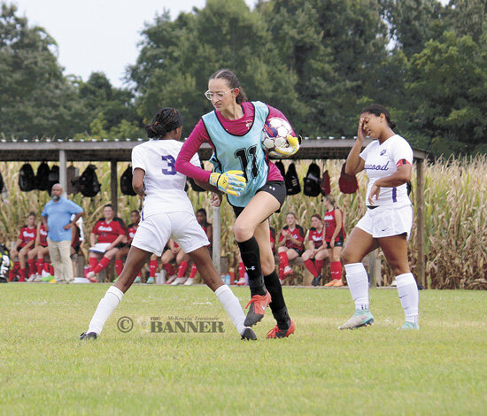 Lady Rebel goalkeeper Rachel Essary scoops up the ball for a save during McKenzie&rsquo;s season-opening shutout of Haywood.