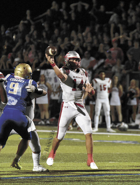 Eyes on the prize! Rebel quarterback Tate Surber looks to the end zone for a game-winning touchdown pass on fourth down with 22 seconds to play.