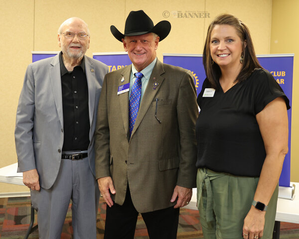 Ed Perkins, a McKenzie Rotarian, District Governor Darrell Ailshie, and McKenzie Rotary President Christy Williams.  Perkins is a past district governor.