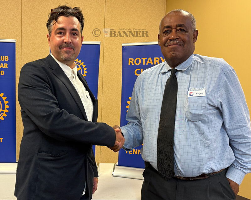 Pictured is Bonalanza (left) with Rotary Vice President Ricky Price (right).