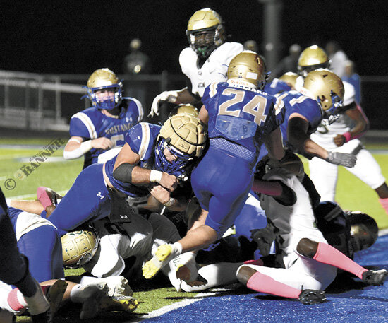 Mustang quarterback Gray Eubanks battles through the pile for a one-yard touchdown to extend Huntingdon’s lead to 14-0.