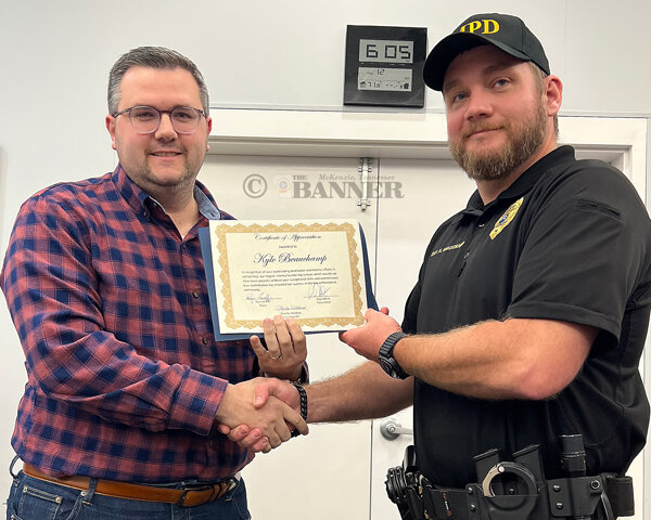McKenzie Mayor Ryan Griffin recognized Investigator Kyle Beauchamp for his work to bring down a multi-state money laundering ring.