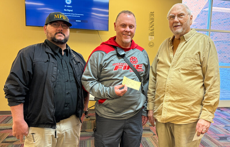 Pictured are Police Chief Ryan White and Fire Chief Brian Tucker accepting the donation from Ed Perkins, chairman of the trustees for the Fannye Baxter Moore Trust Fund.