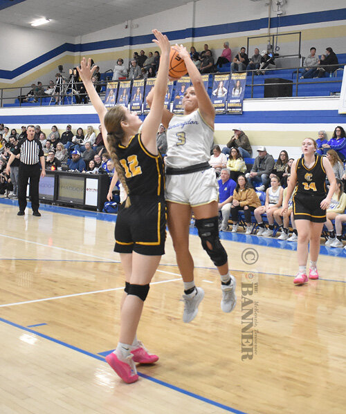 Huntingdon’s Delaney Byars pulls up for a jumper over a Camden defender.