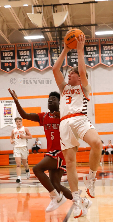 Bulldog Kade Sawyers goes strong to the hoop. Sawyers led all scorers with 22 points.