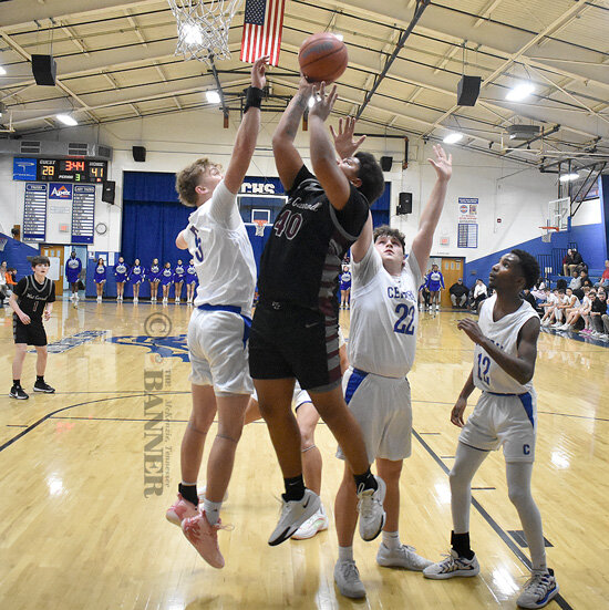 War Eagle Kayden Melton goes up strong to put back a rebound. Melton led West Carroll with 17 points.