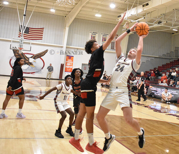 War Eagle Chandler Rimmer leans back to shoot over a Bradford defender.
