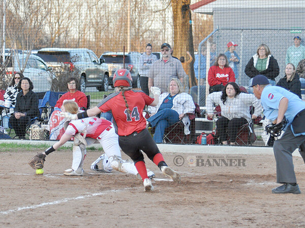 Lady Rebel Aurora Johnson slides into home safely in the Game Two win.