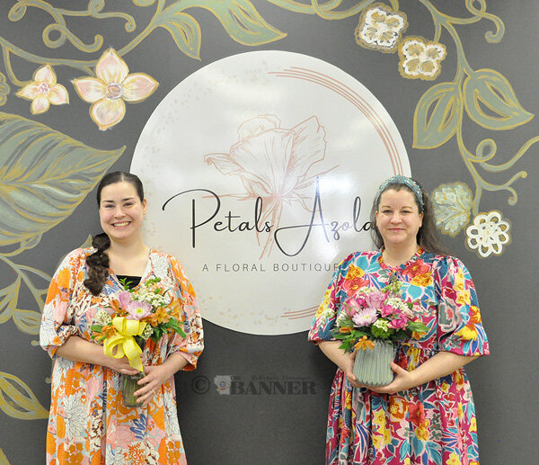 Petals Azola owners Kaylynn Legg (left) and Angela Diller display a pair of beautiful floral arrangements.