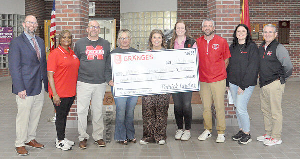 Pictured are (L to R): Director of Schools Dr. Justin Barden, School Board Chairman LaShonda Williams, school board members Bobby Young and Misty Aird, Gr&auml;nges Recruiter and Retention Specialist Rachel Carter, Gr&auml;nges Senior HR Generalist Hannah Barger, MHS Baseball Coach Chris Wall, Gr&auml;nges HR Manager Brooklyn Napier and MHS Principal Kelly Spivey.
