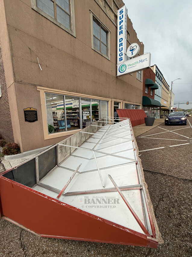 Super Drugs awning detached from the building on Thursday during a severe weather event.