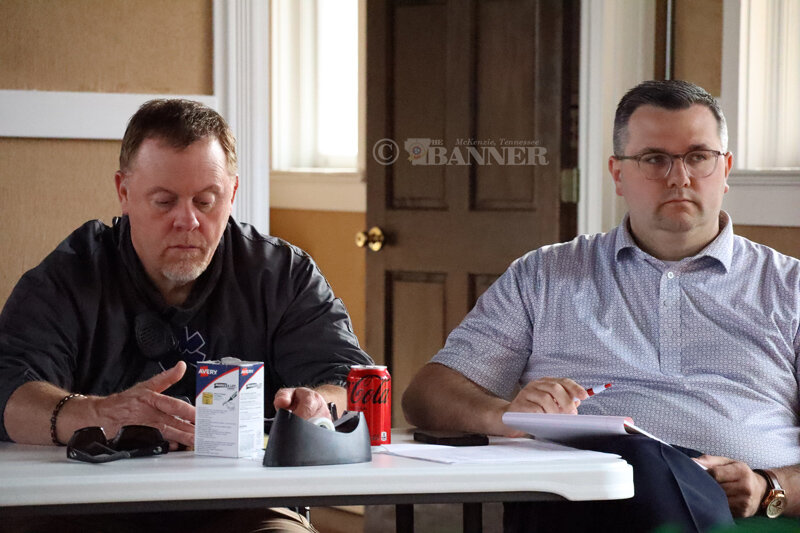 Fire Chief Brian Tucker and McKenzie Mayor Ryan Griffin listen to department supervisors present their goals for the City of McKenzie.