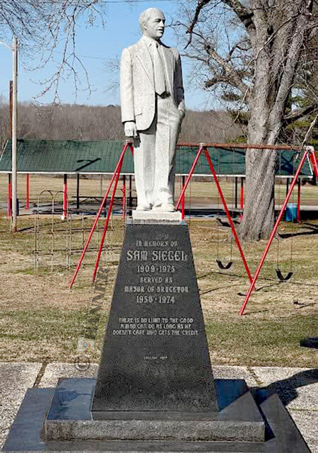 A statue of Sam Siegel stands in Bruceton as a memorial of his contributions to the town and surrounding area.