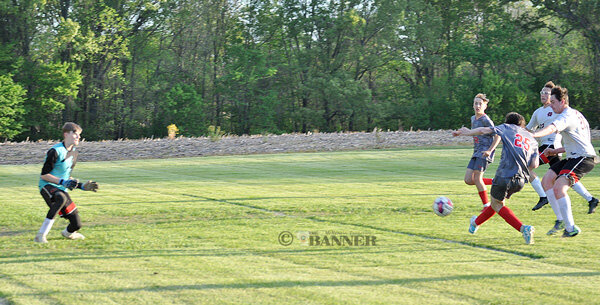 Rebel Marshal Vinson fires past the Hickman County goalkeeper and scores.